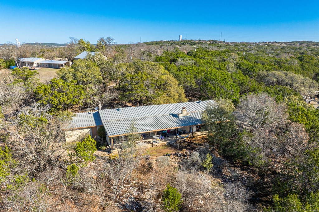 135 Rooster Ridge Kerrville, TX 78028 - Photo 12 of 27 an aerial view of a house with a yard and lake view