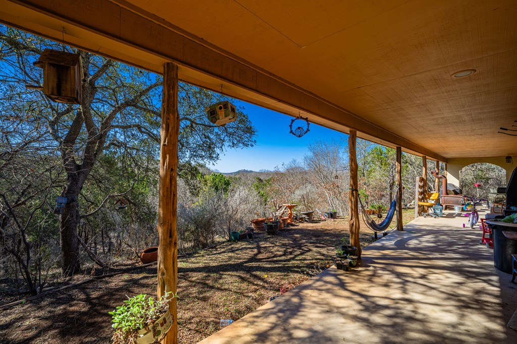 135 Rooster Ridge Kerrville, TX 78028 - Photo 24 of 27 a view of a street with a tree