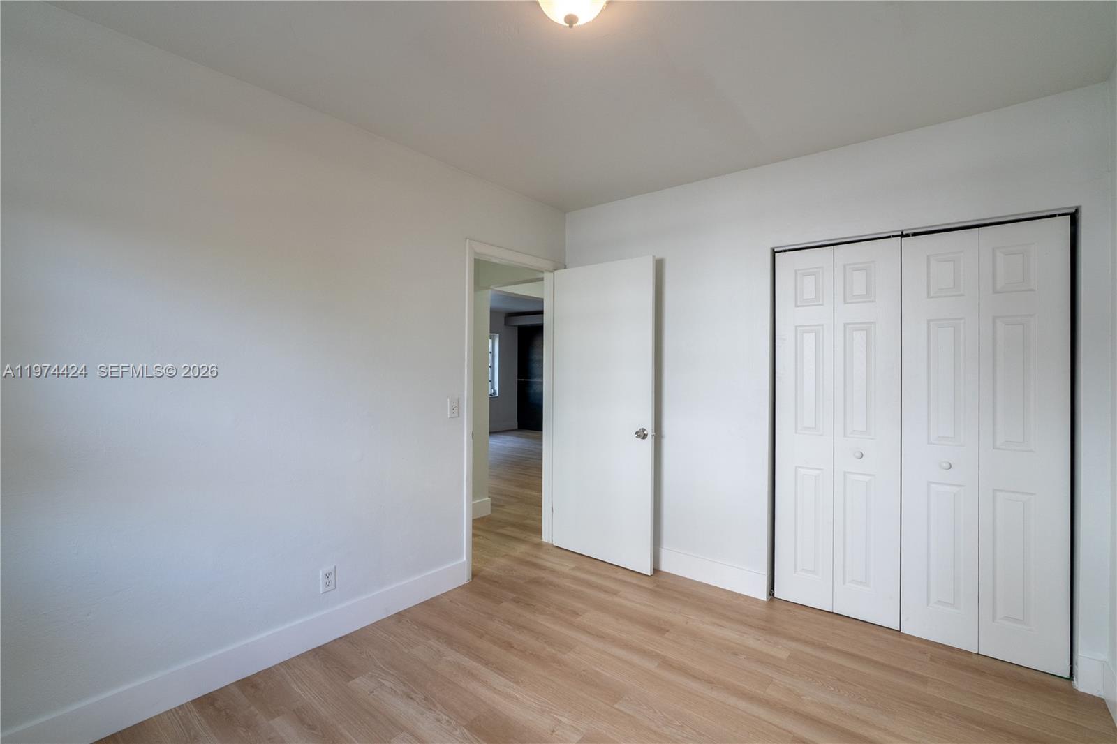 3665 Southwest 16th Street, Unit 3665 Miami, FL 33145 - Photo 12 of 25 a view of an empty room with wooden floor