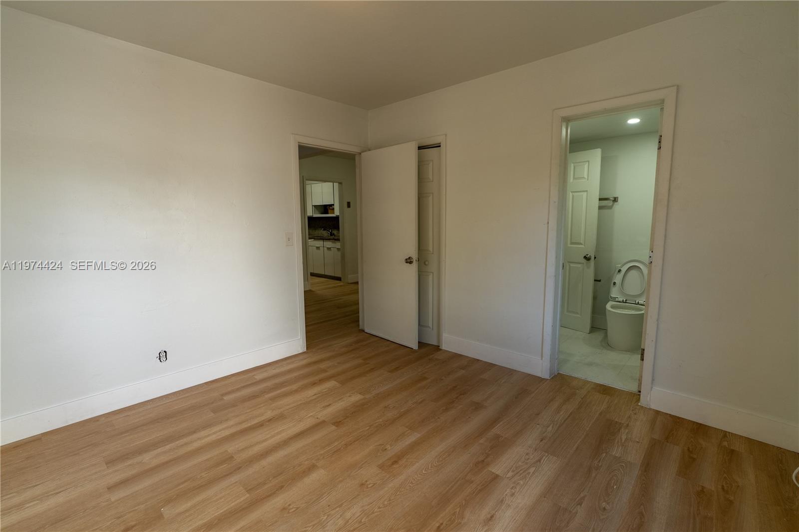 3665 Southwest 16th Street, Unit 3665 Miami, FL 33145 - Photo 14 of 25 wooden floor in an empty room