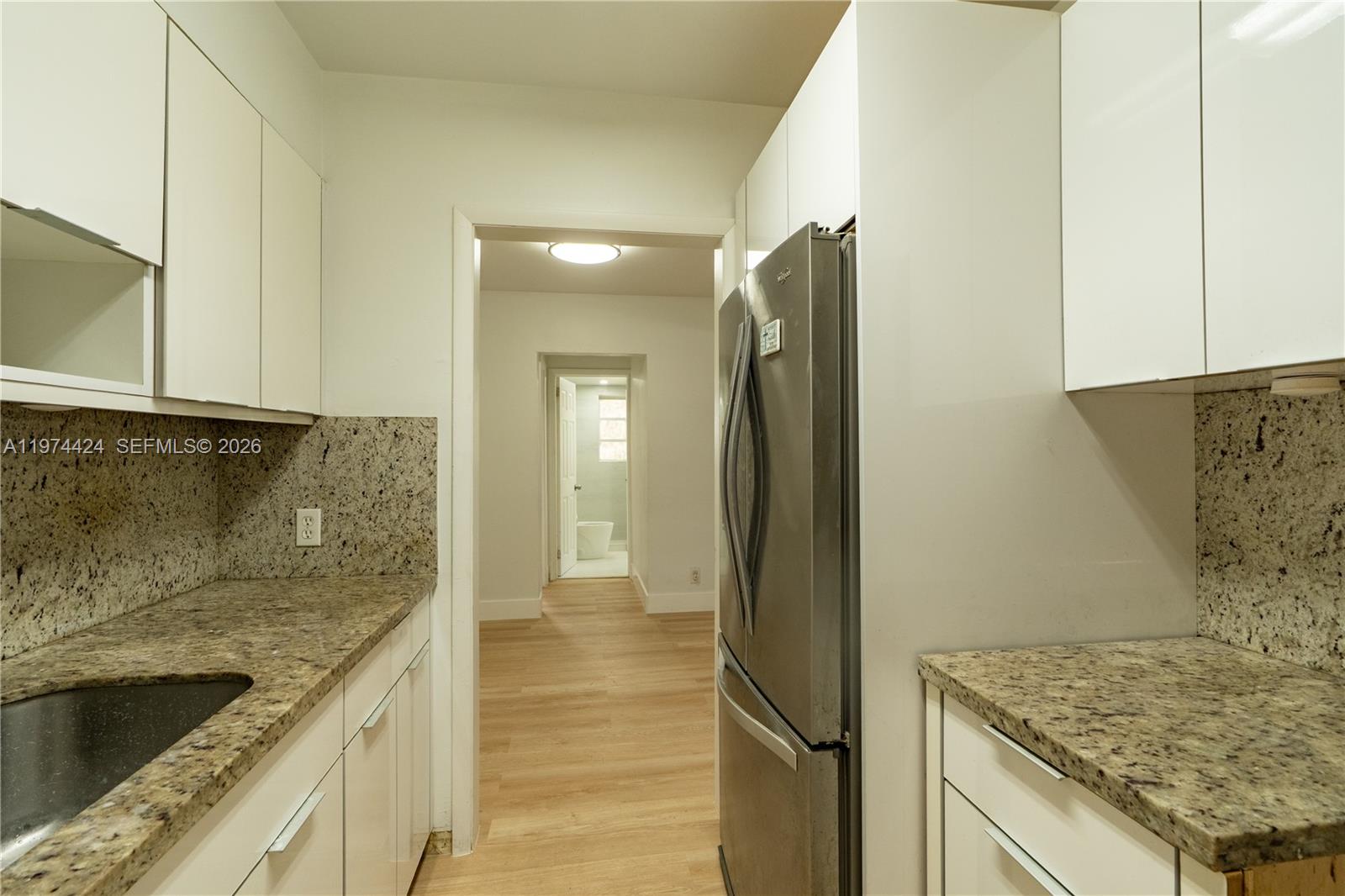 3665 Southwest 16th Street, Unit 3665 Miami, FL 33145 - Photo 21 of 25 a view of a kitchen cabinets and a counter place