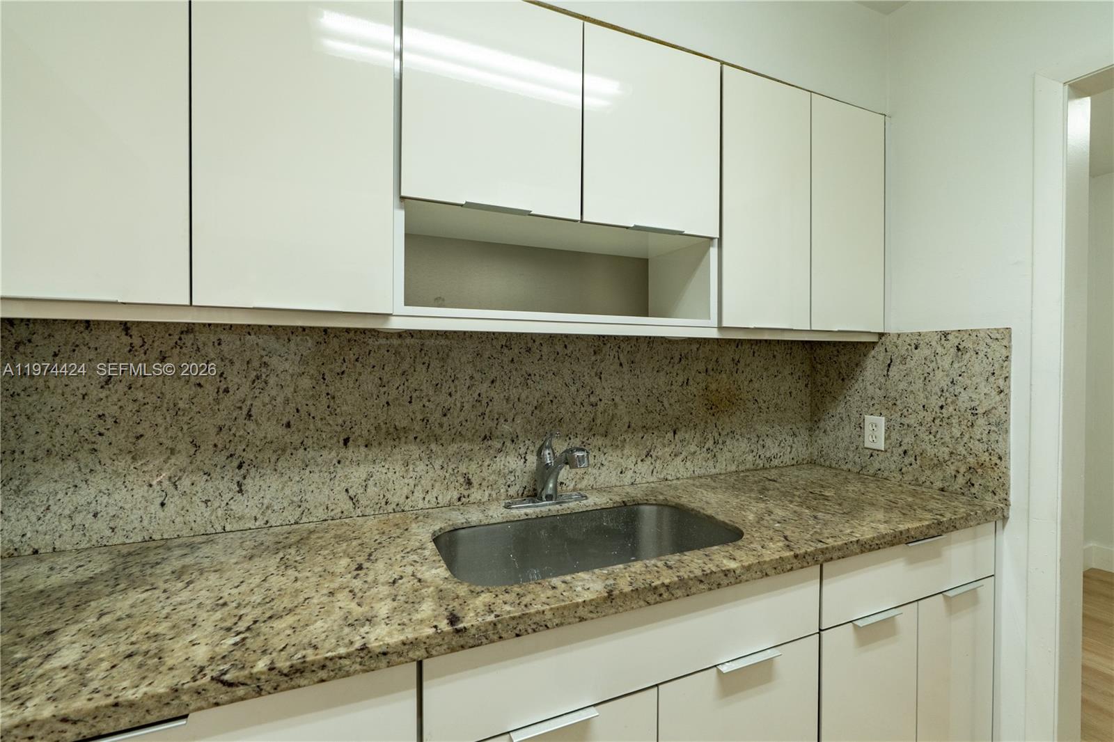 3665 Southwest 16th Street, Unit 3665 Miami, FL 33145 - Photo 22 of 25 a kitchen with a sink and cabinets