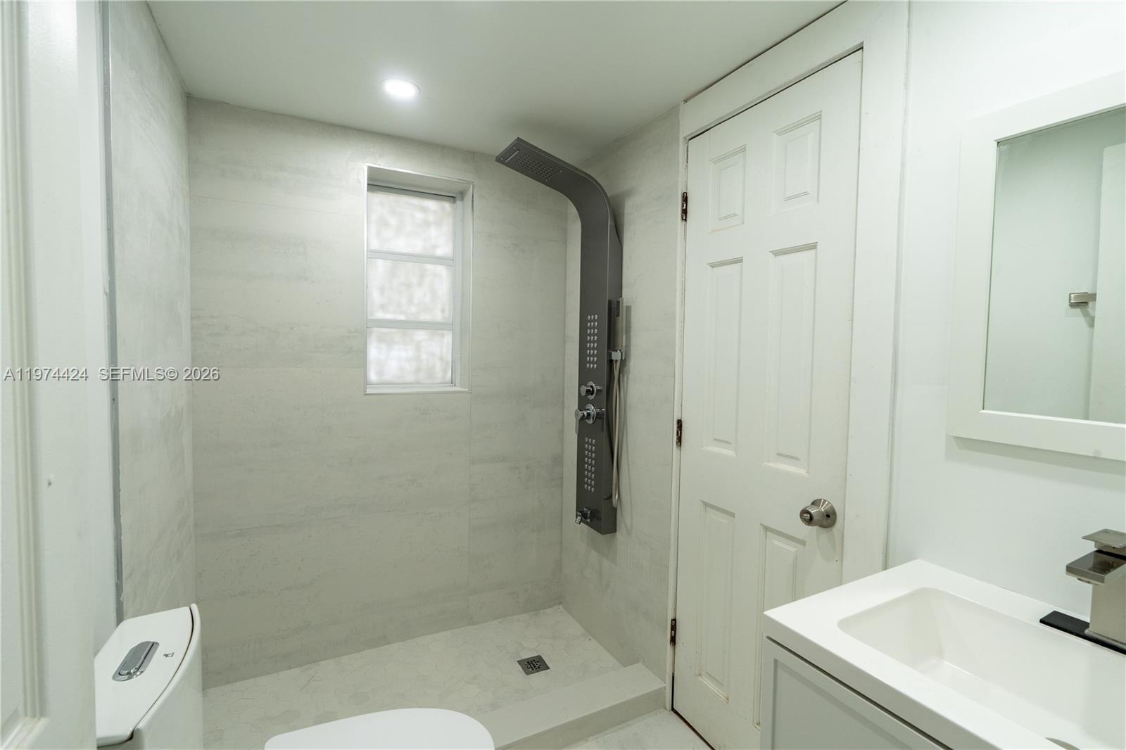 3665 Southwest 16th Street, Unit 3665 Miami, FL 33145 - Photo 23 of 25 a bathroom with a sink a toilet and shower