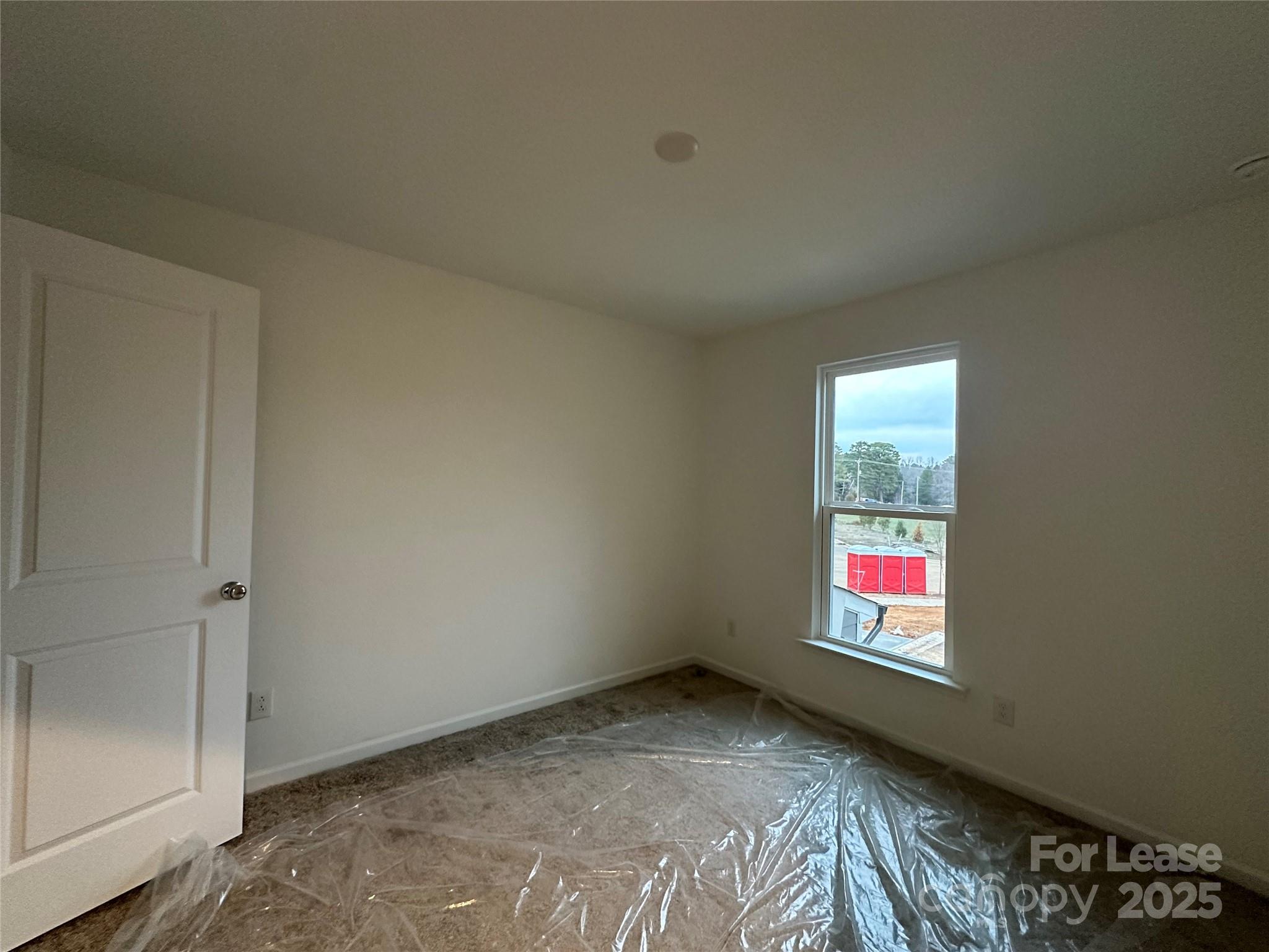 1872 Teachers House Road Concord, NC 28027 - Photo 13 of 14 a view of an empty room and window