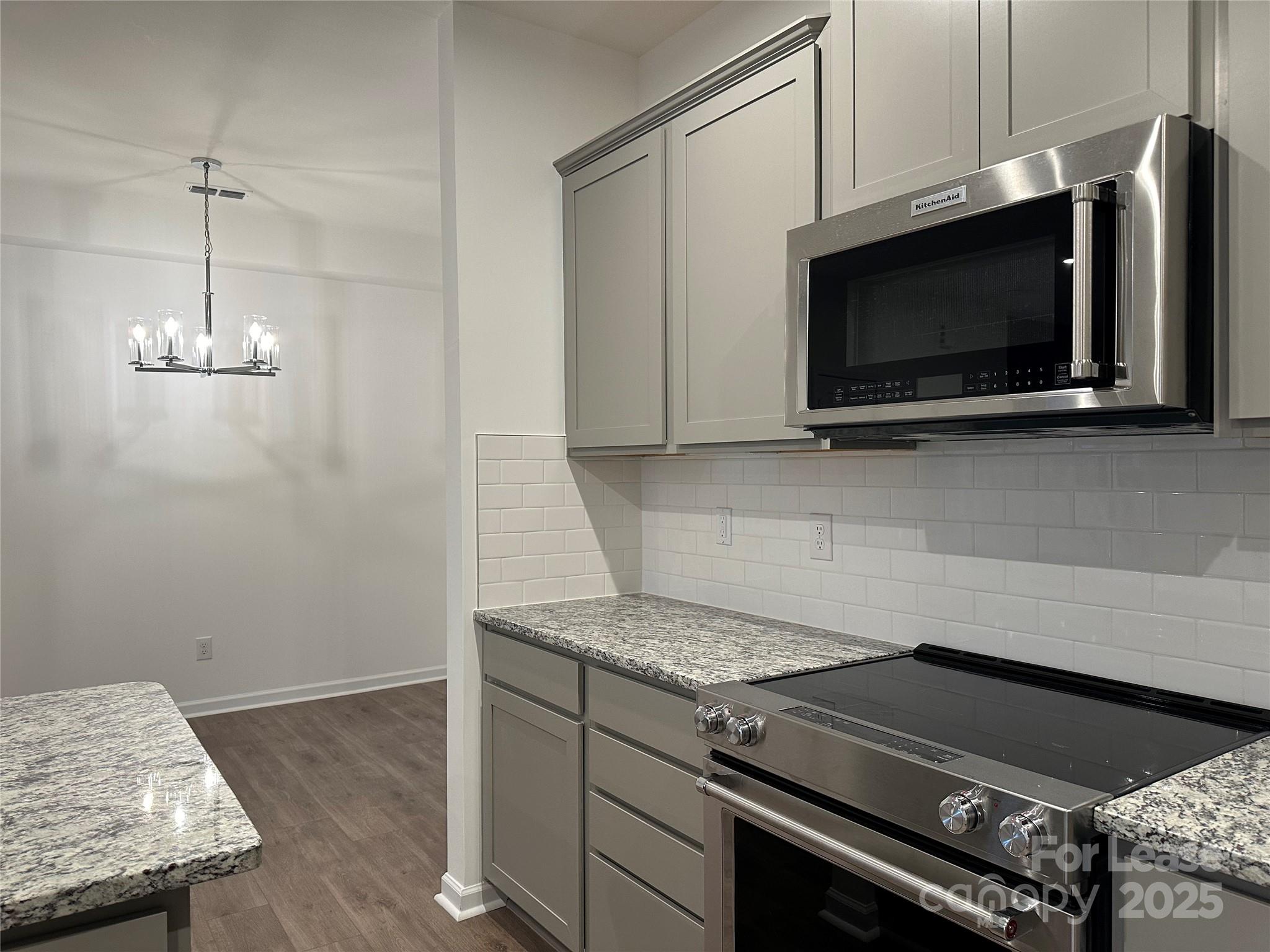 1872 Teachers House Road Concord, NC 28027 - Photo 6 of 14 a kitchen with a stove and a microwave