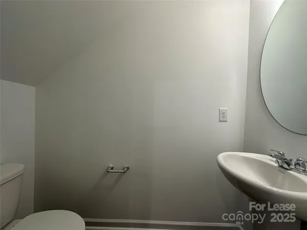 a bathroom with a toilet and a sink