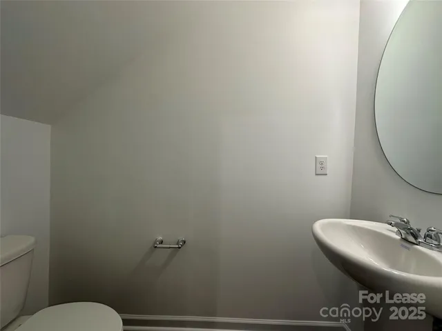 a bathroom with a toilet and a sink