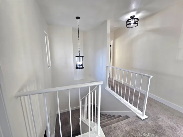 a view of a hallway with windows