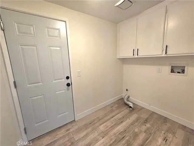 a view of small space with wooden floor