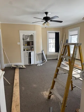 a view of a livingroom with furniture and staircase