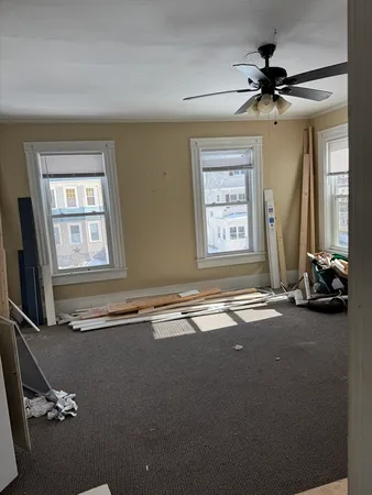 a view of a livingroom with furniture and a window