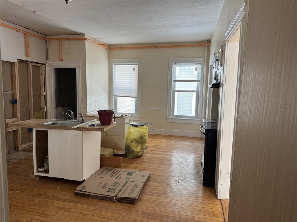 93 Fairfax Road Worcester, MA 01610 - Photo 9 of 35 a living room with stainless steel appliances kitchen island granite countertop furniture and a window