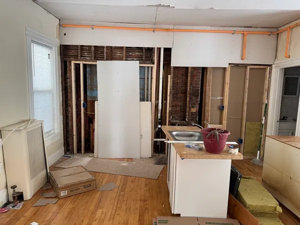 a kitchen with a refrigerator and a stove