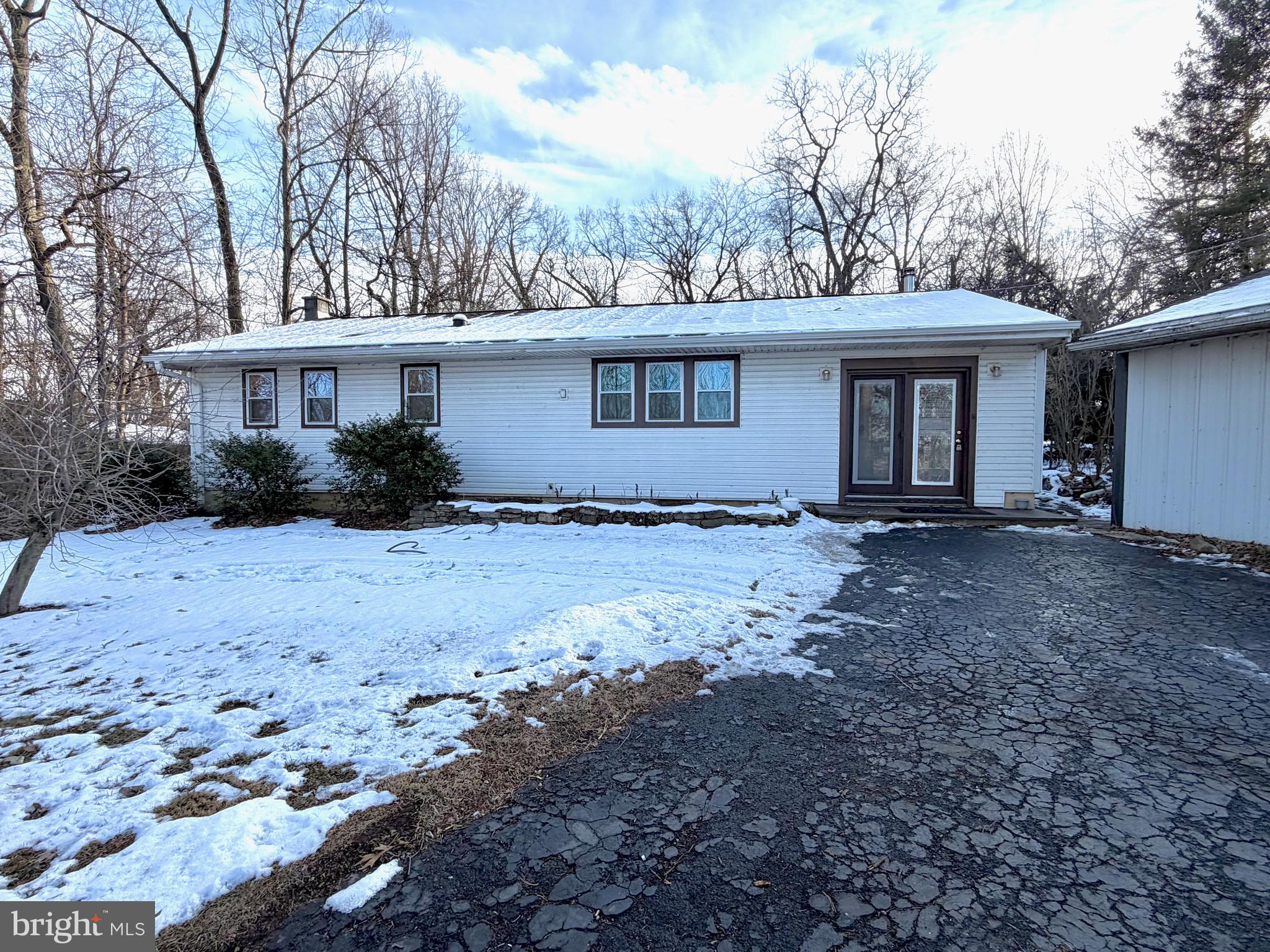490 Meadow Lane Lebanon, PA 17042 - Photo 2 of 31 a view of a house with a yard covered with snow in the background
