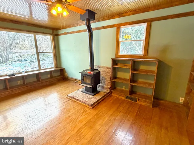 a living room with furniture and large windows