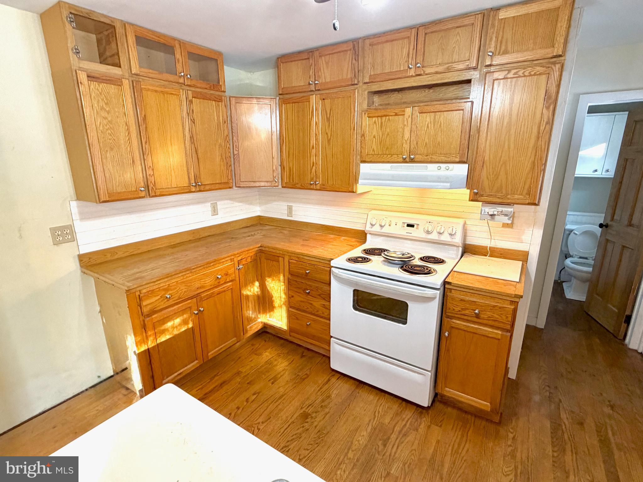 490 Meadow Lane Lebanon, PA 17042 - Photo 10 of 31 a kitchen with a stove a sink and a microwave