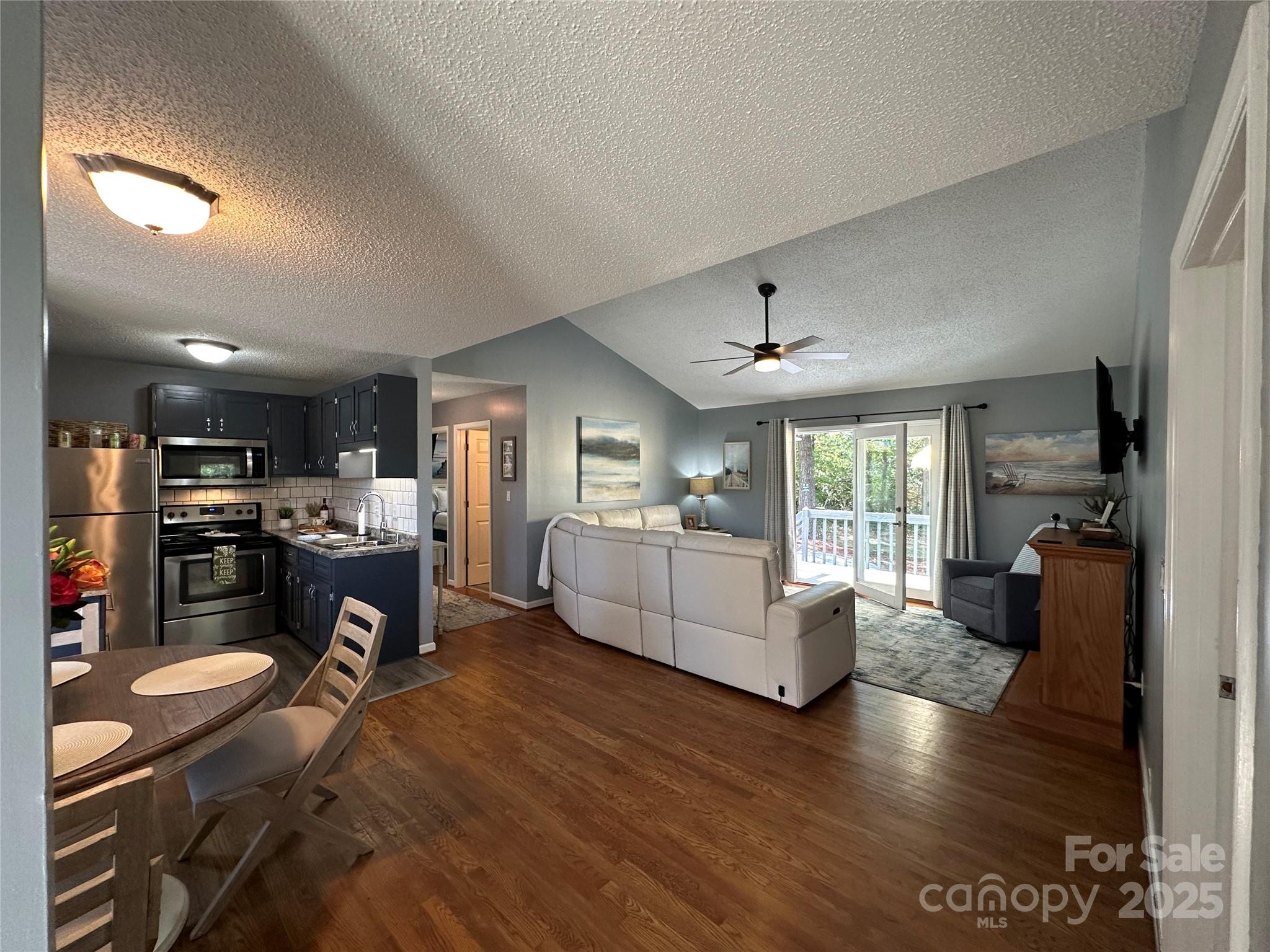 102 Stephens Drive Morganton, NC 28655 - Photo 12 of 48 a living room with furniture and a wooden floor