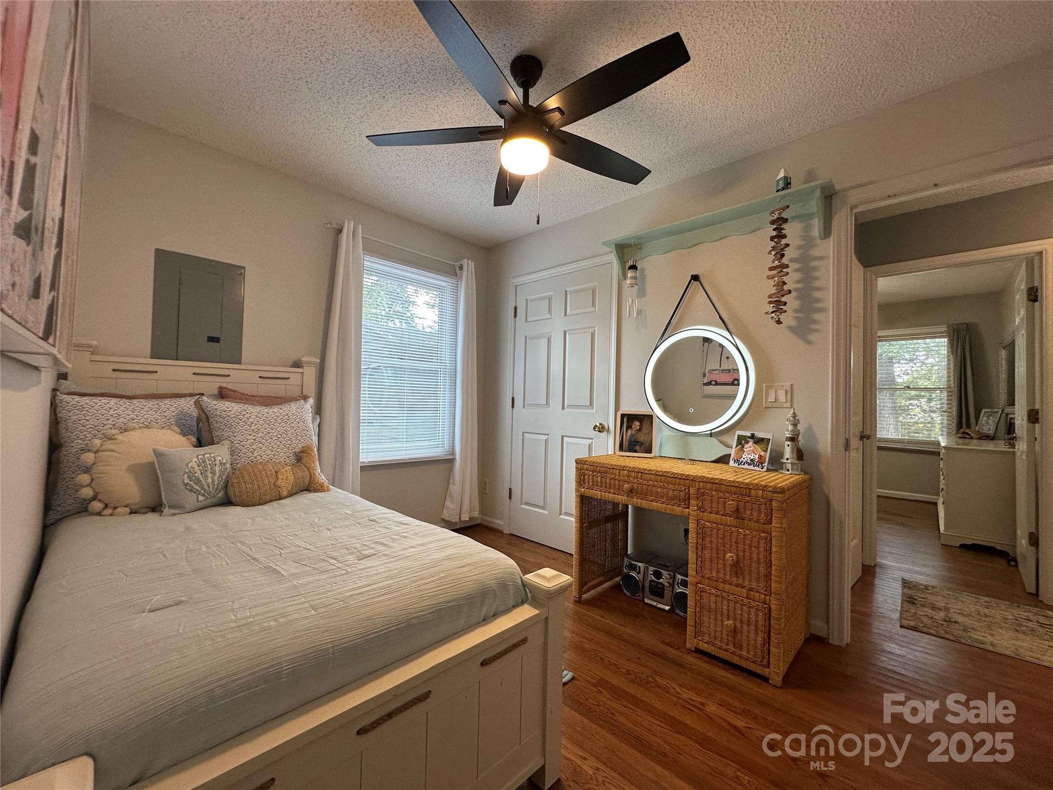 102 Stephens Drive Morganton, NC 28655 - Photo 23 of 48 a bedroom with a bed and a chandelier