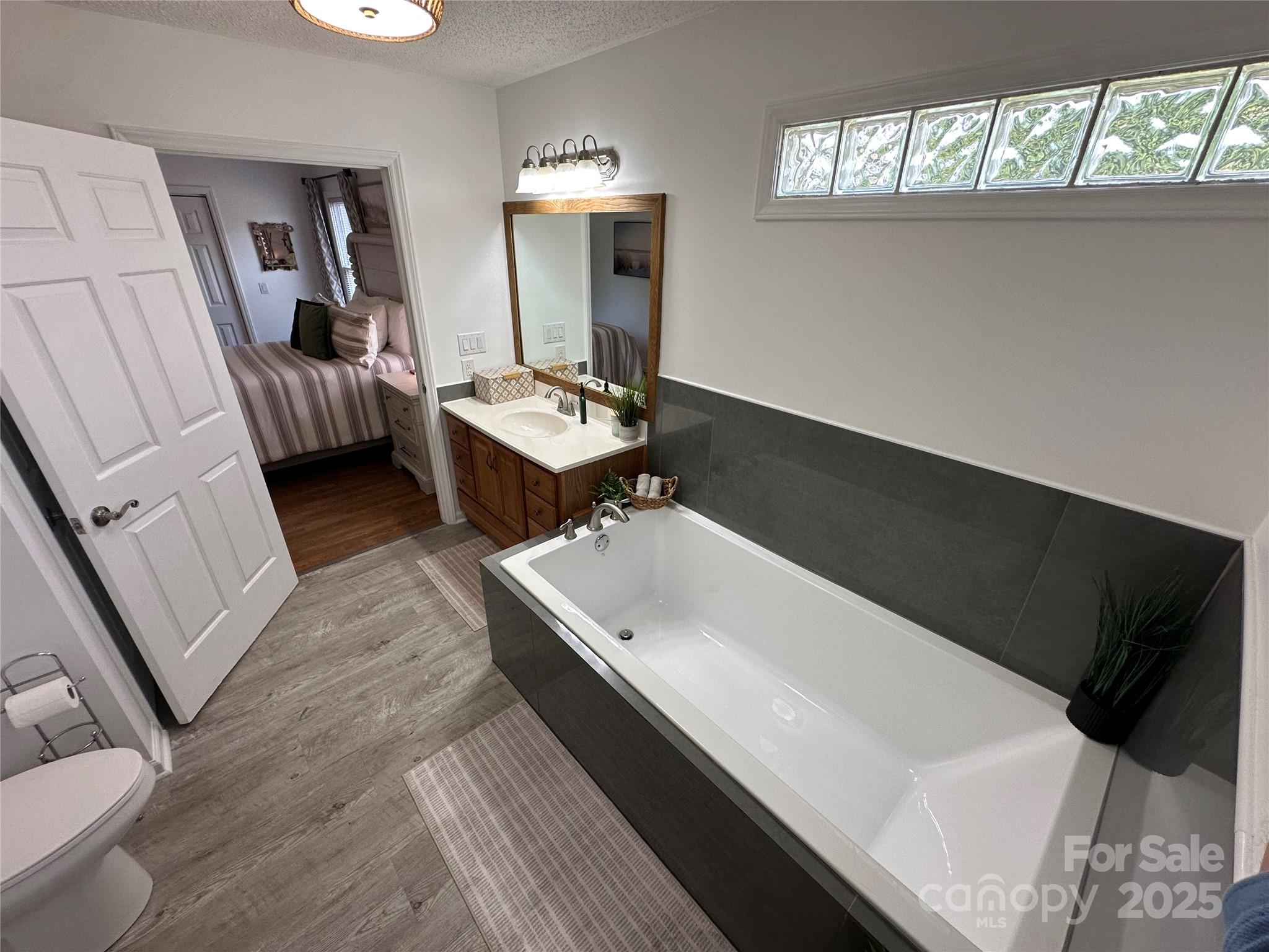 102 Stephens Drive Morganton, NC 28655 - Photo 26 of 48 a living room with furniture and a mirror