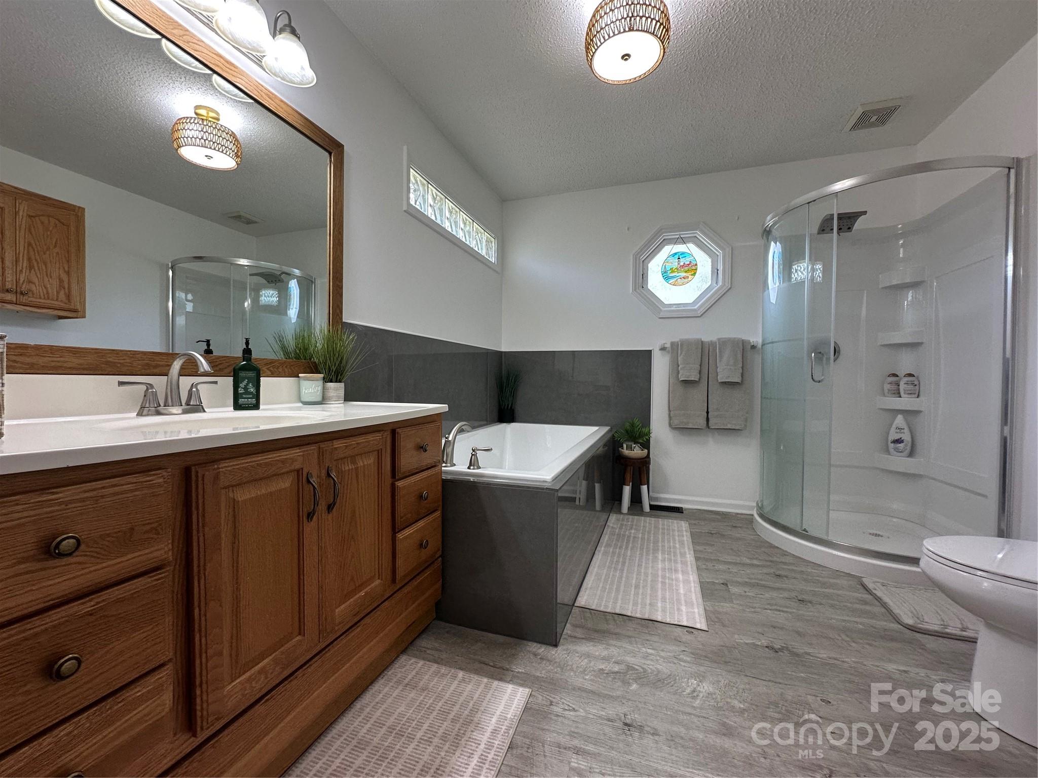 102 Stephens Drive Morganton, NC 28655 - Photo 27 of 48 a bathroom with a sink a toilet and shower