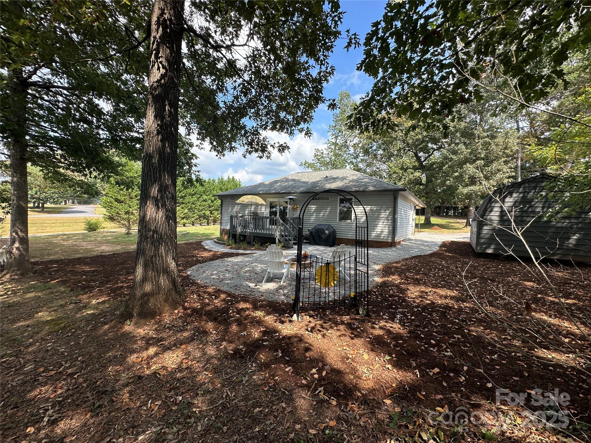 102 Stephens Drive Morganton, NC 28655 - Photo 36 of 48 a view of a house with backyard and a tree