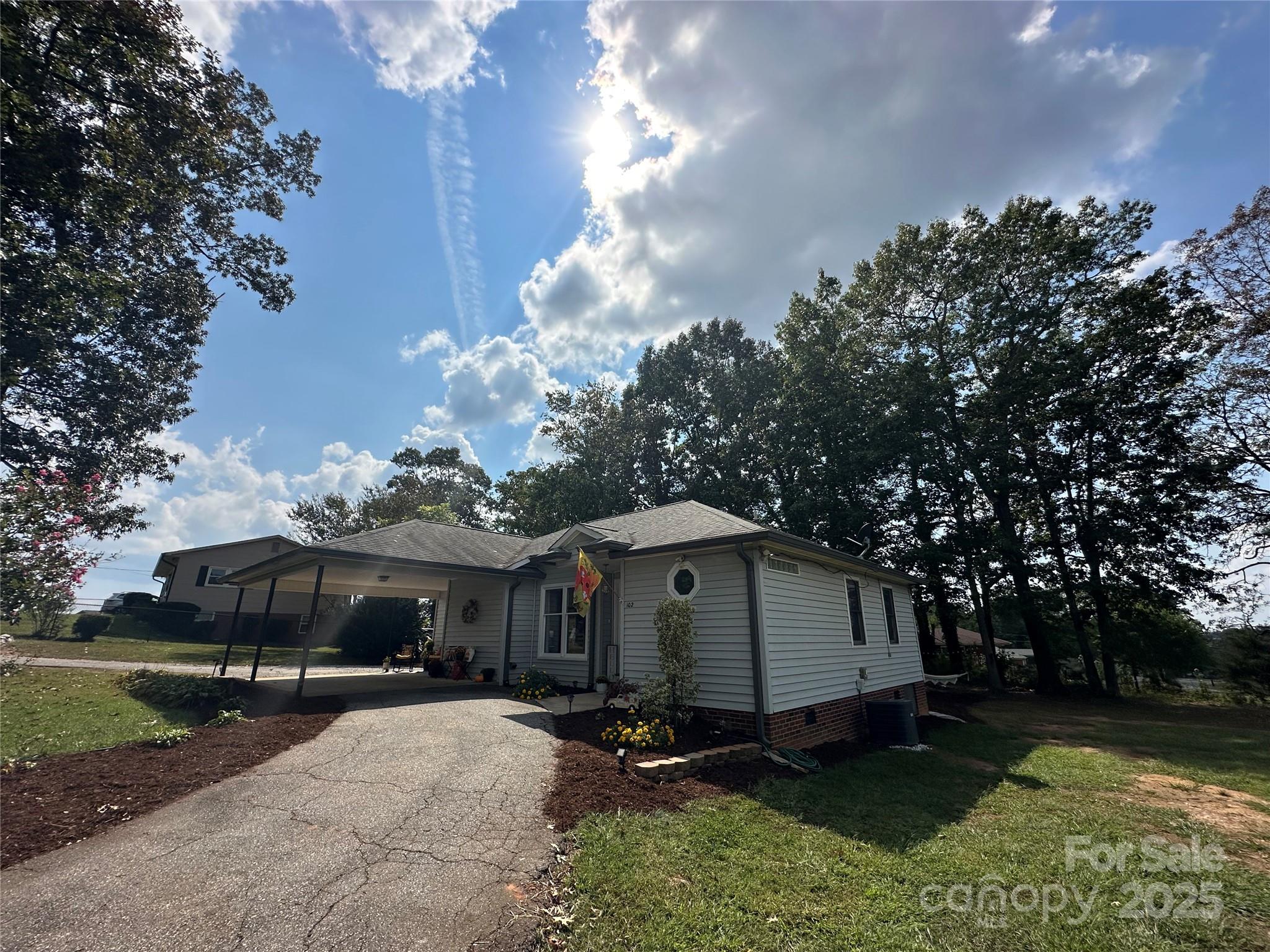 102 Stephens Drive Morganton, NC 28655 - Photo 39 of 48 a view of a house with a yard and a large tree