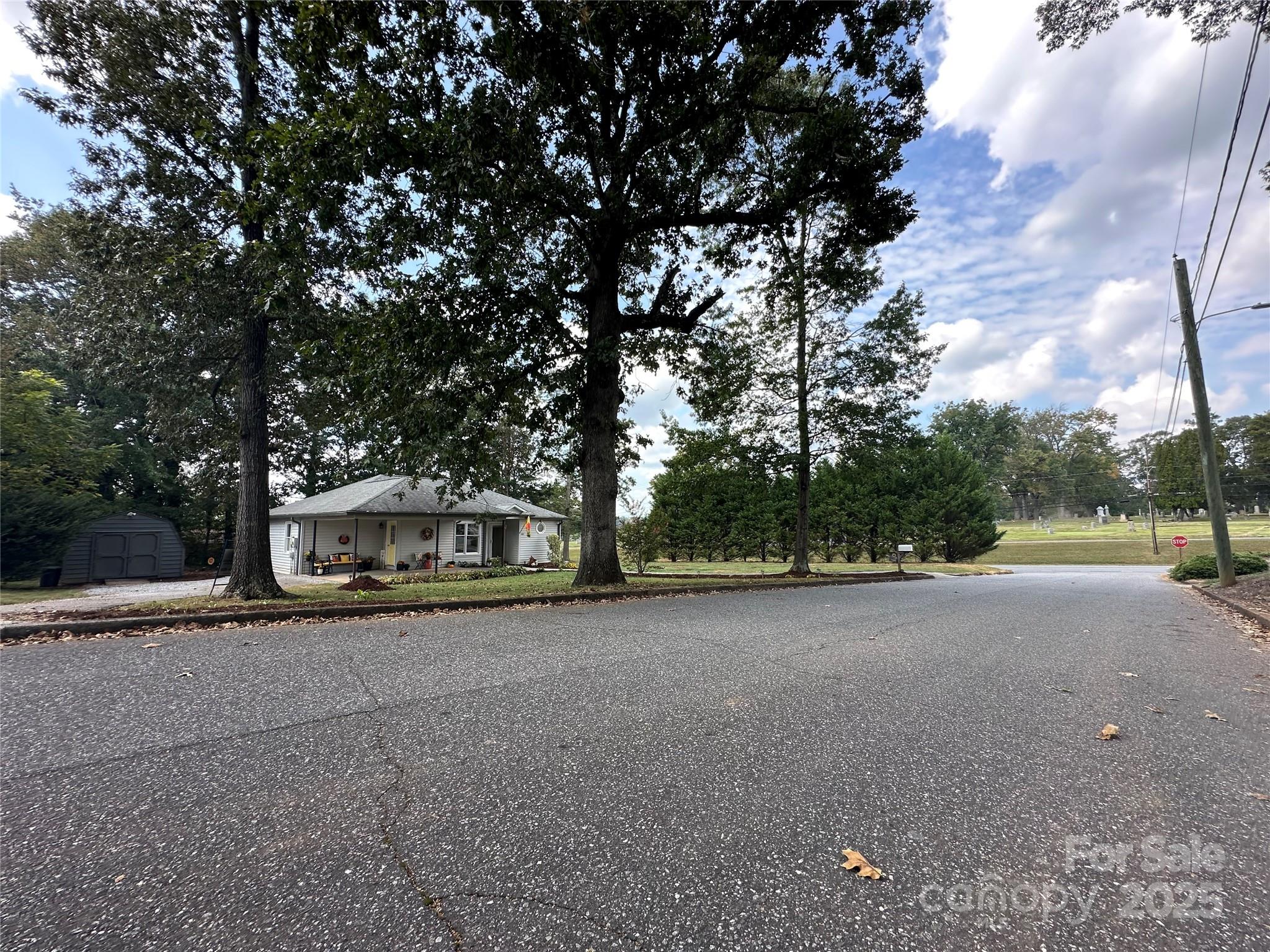 102 Stephens Drive Morganton, NC 28655 - Photo 41 of 48 a view of a street with a trees in the background