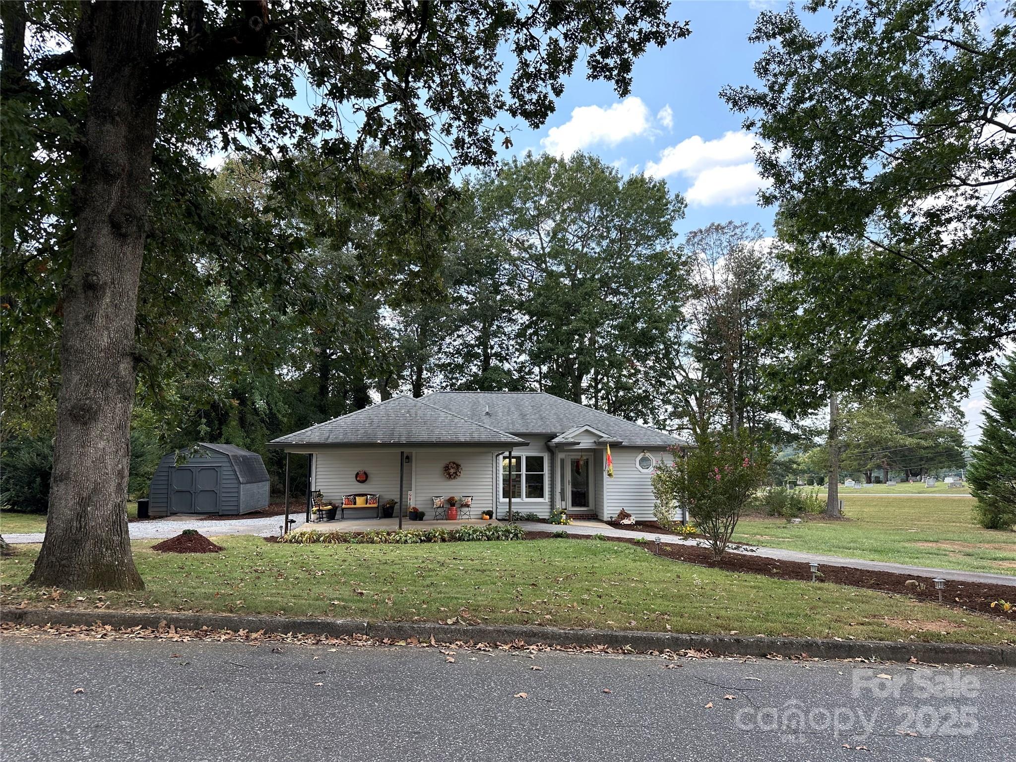 102 Stephens Drive Morganton, NC 28655 - Photo 5 of 48 a front view of a house with a yard