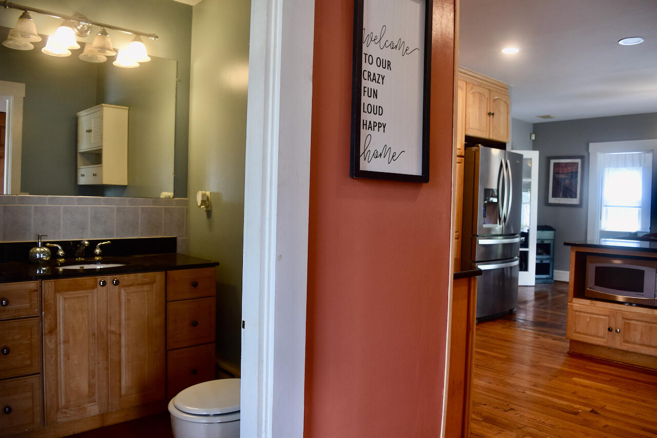 99 South Main Street Acushnet, MA 02743 - Photo 15 of 46 a bathroom with a toilet a sink and mirror