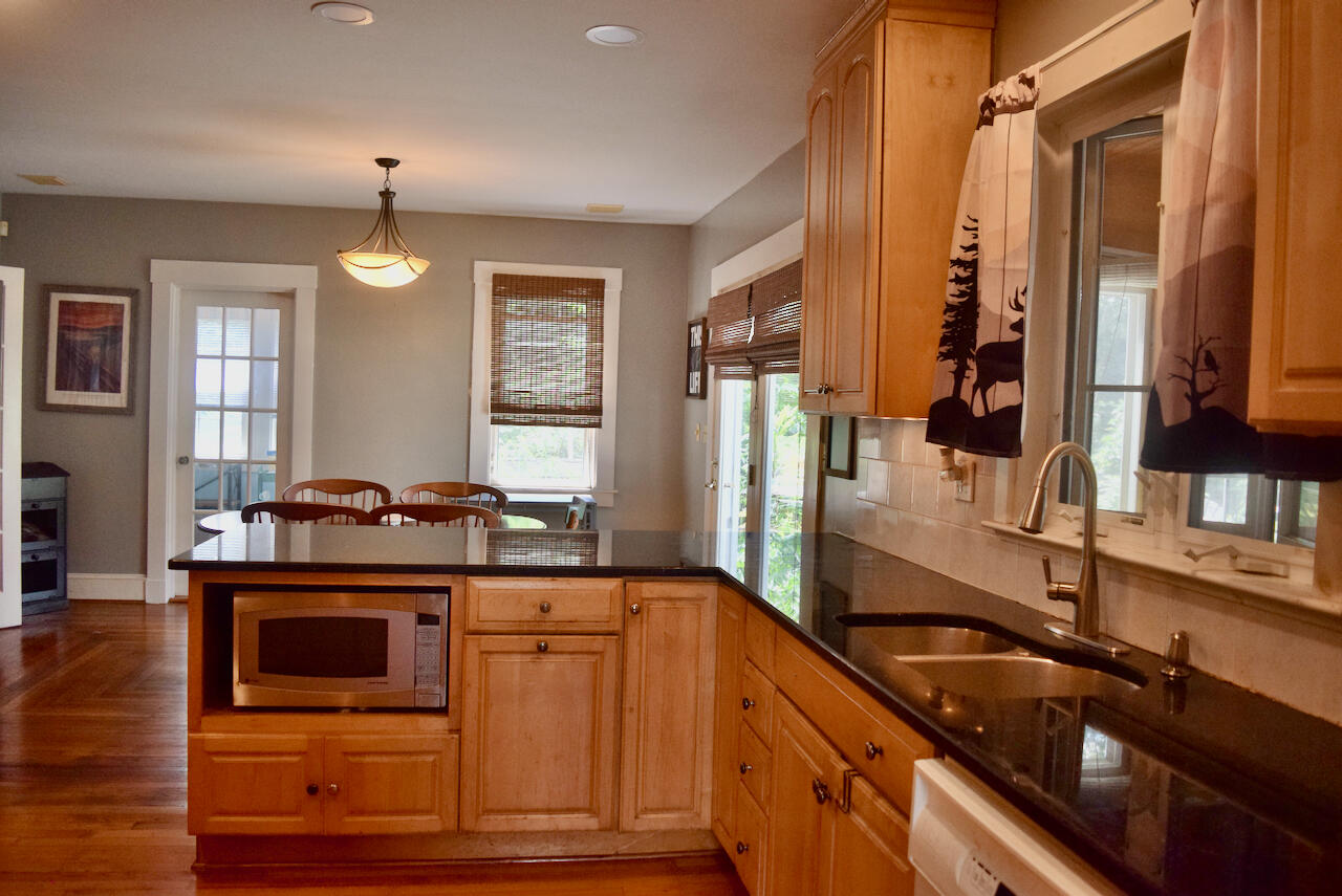 99 South Main Street Acushnet, MA 02743 - Photo 17 of 46 a kitchen with stainless steel appliances granite countertop a stove a sink and a refrigerator
