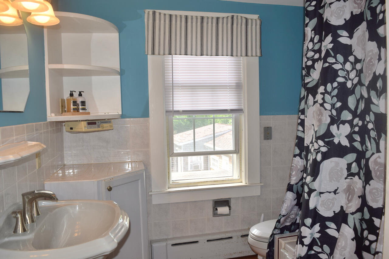 99 South Main Street Acushnet, MA 02743 - Photo 22 of 46 a bathroom with a sink and a window