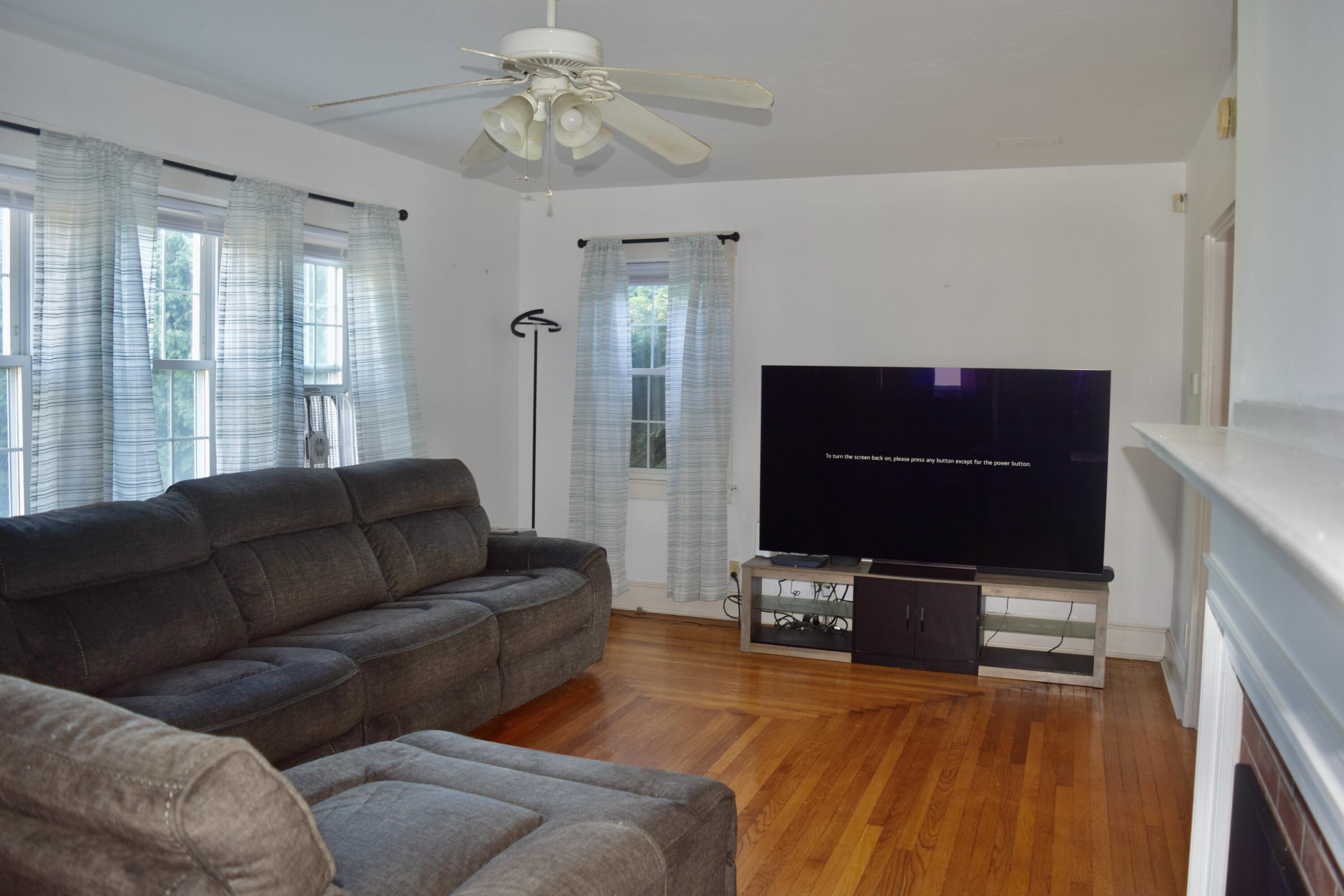 99 South Main Street Acushnet, MA 02743 - Photo 5 of 46 a living room with furniture and a flat screen tv