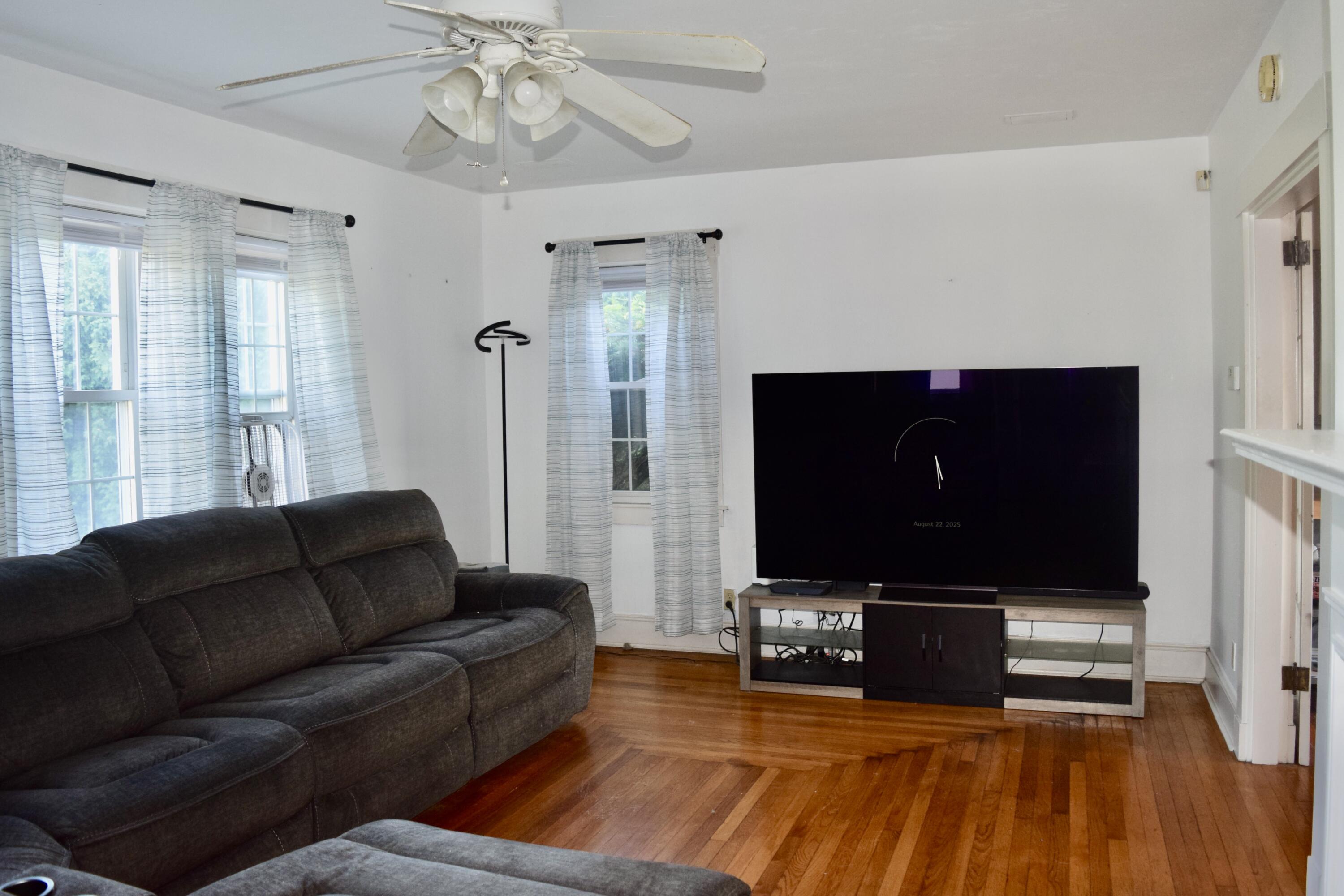 99 South Main Street Acushnet, MA 02743 - Photo 8 of 46 a living room with furniture and a flat screen tv