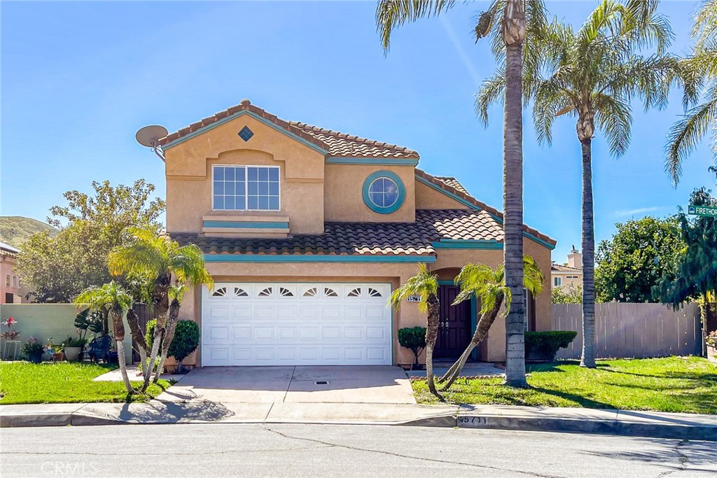 15711 Firethorn Road Fontana, CA 92337 - Photo 1 of 1 a view of a house with a yard and potted plants
