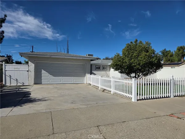 a front view of a house with a garage