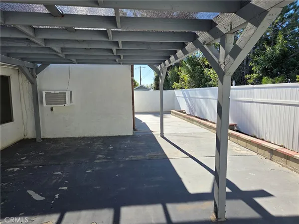 a roof deck with table and chairs