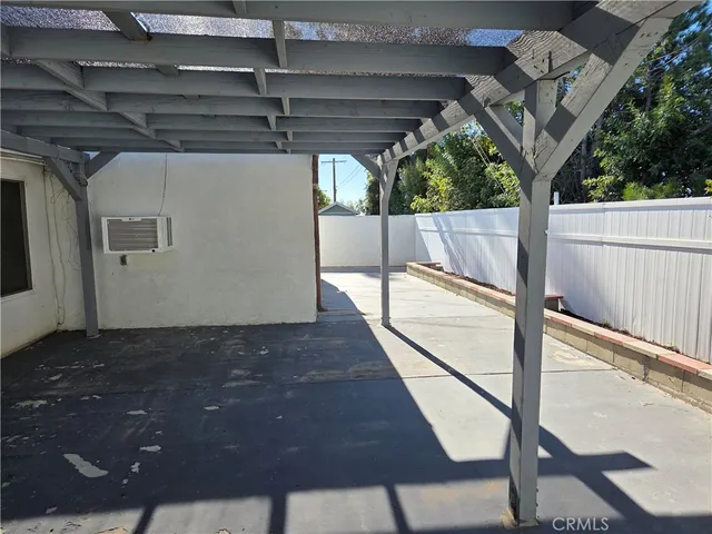 a roof deck with table and chairs