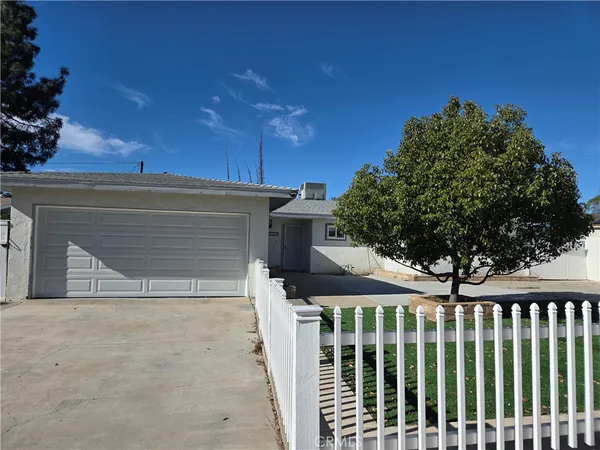 a front view of a house with a garage