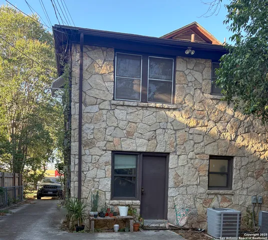 a front view of a house with parking area