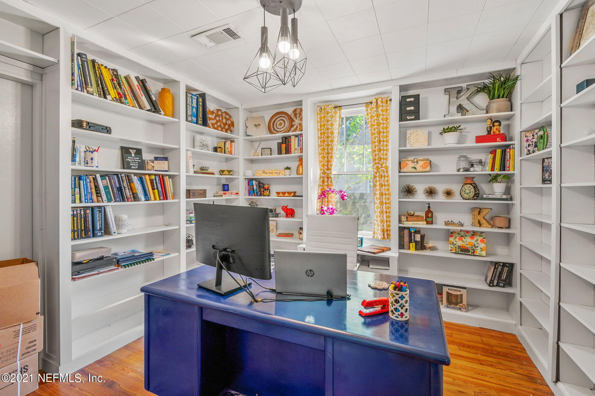 2883 Forbes Street Jacksonville, FL 32205 - Photo 15 of 30 a work room with furniture and a book shelf