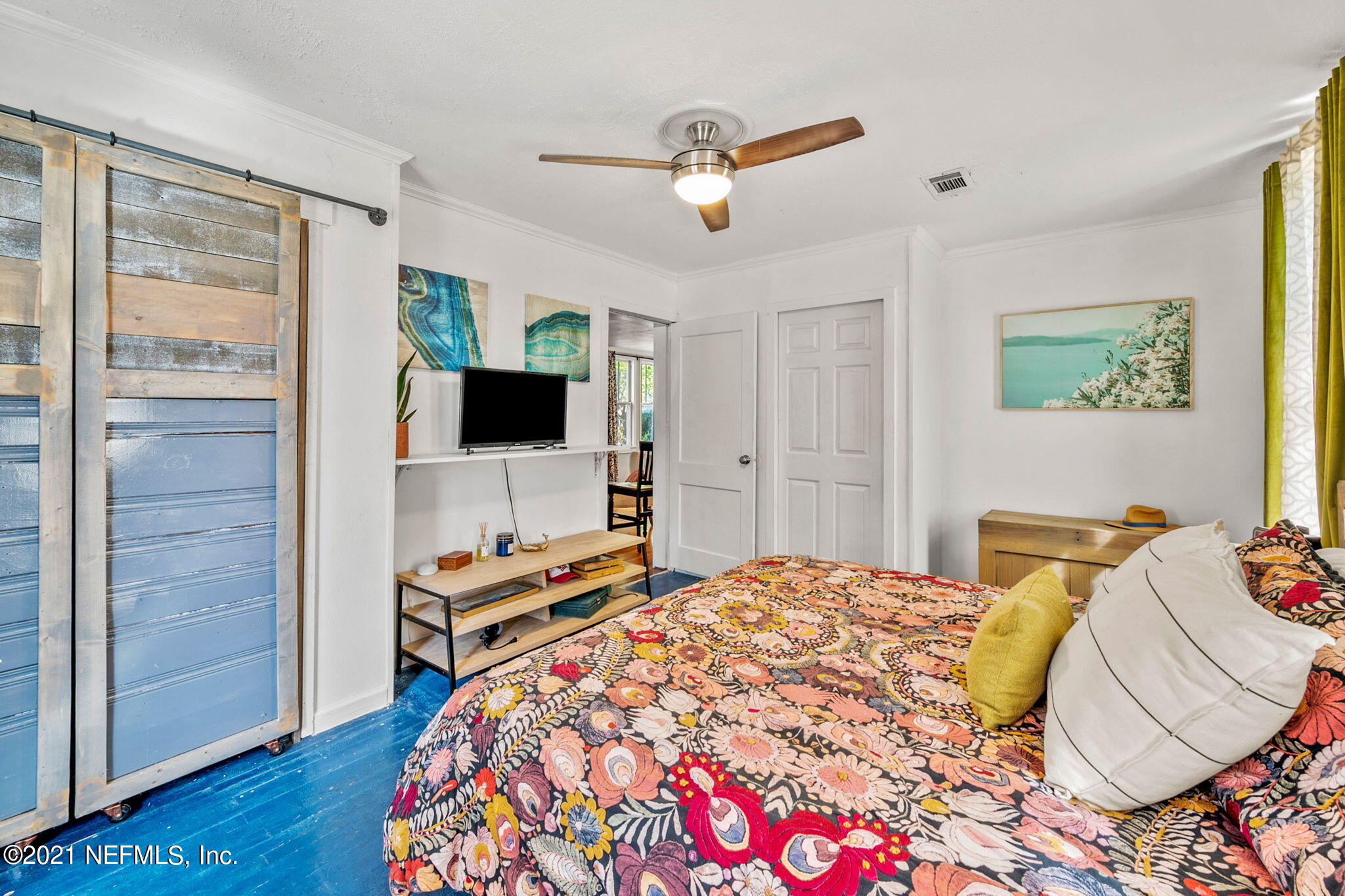2883 Forbes Street Jacksonville, FL 32205 - Photo 23 of 30 a bedroom with a bed and a flat screen tv