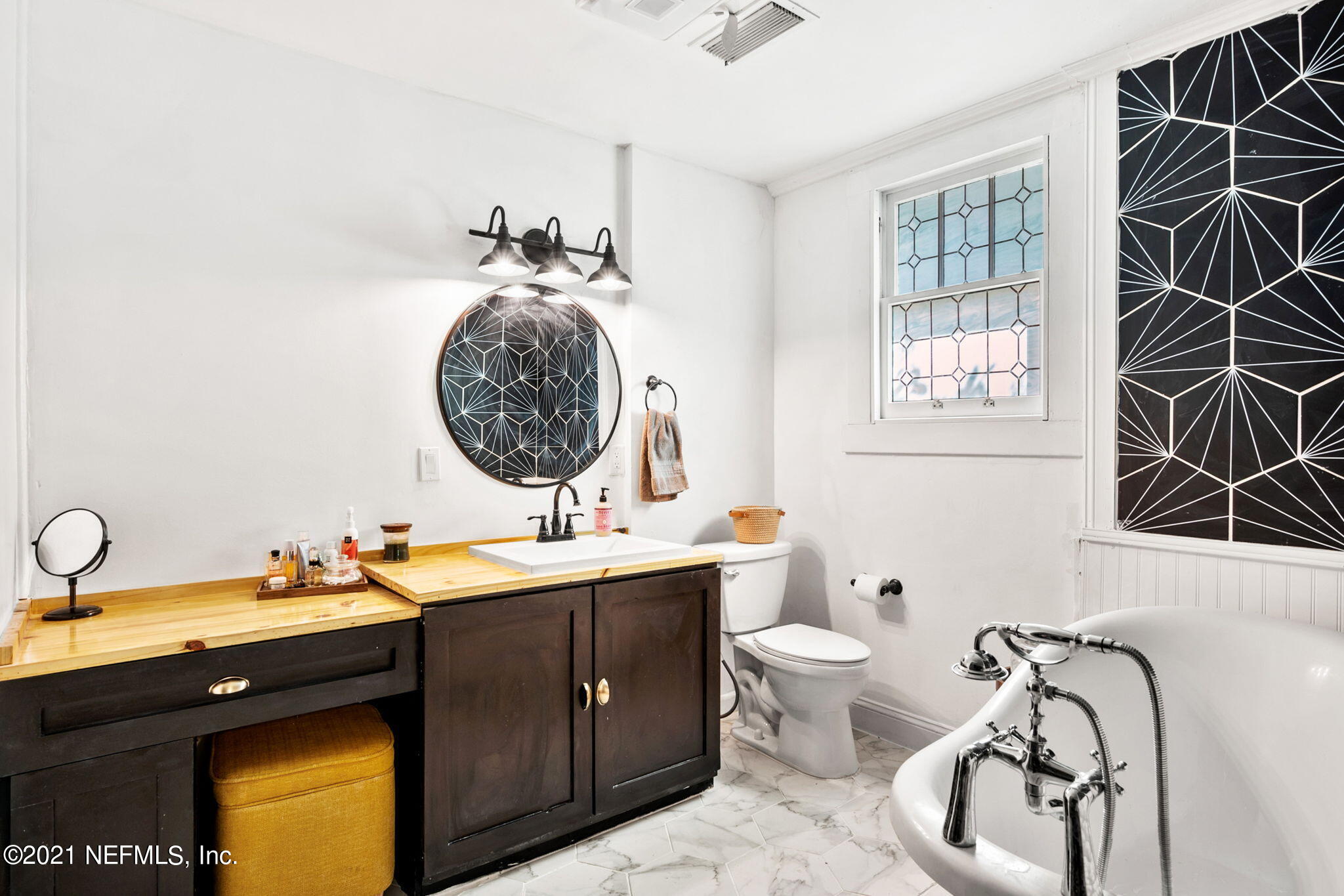 2883 Forbes Street Jacksonville, FL 32205 - Photo 25 of 30 a bathroom with a double vanity sink and a mirror