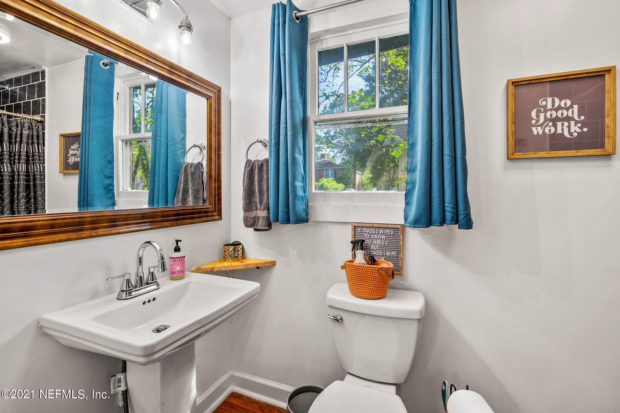 2883 Forbes Street Jacksonville, FL 32205 - Photo 26 of 30 a bathroom with a sink toilet and a window
