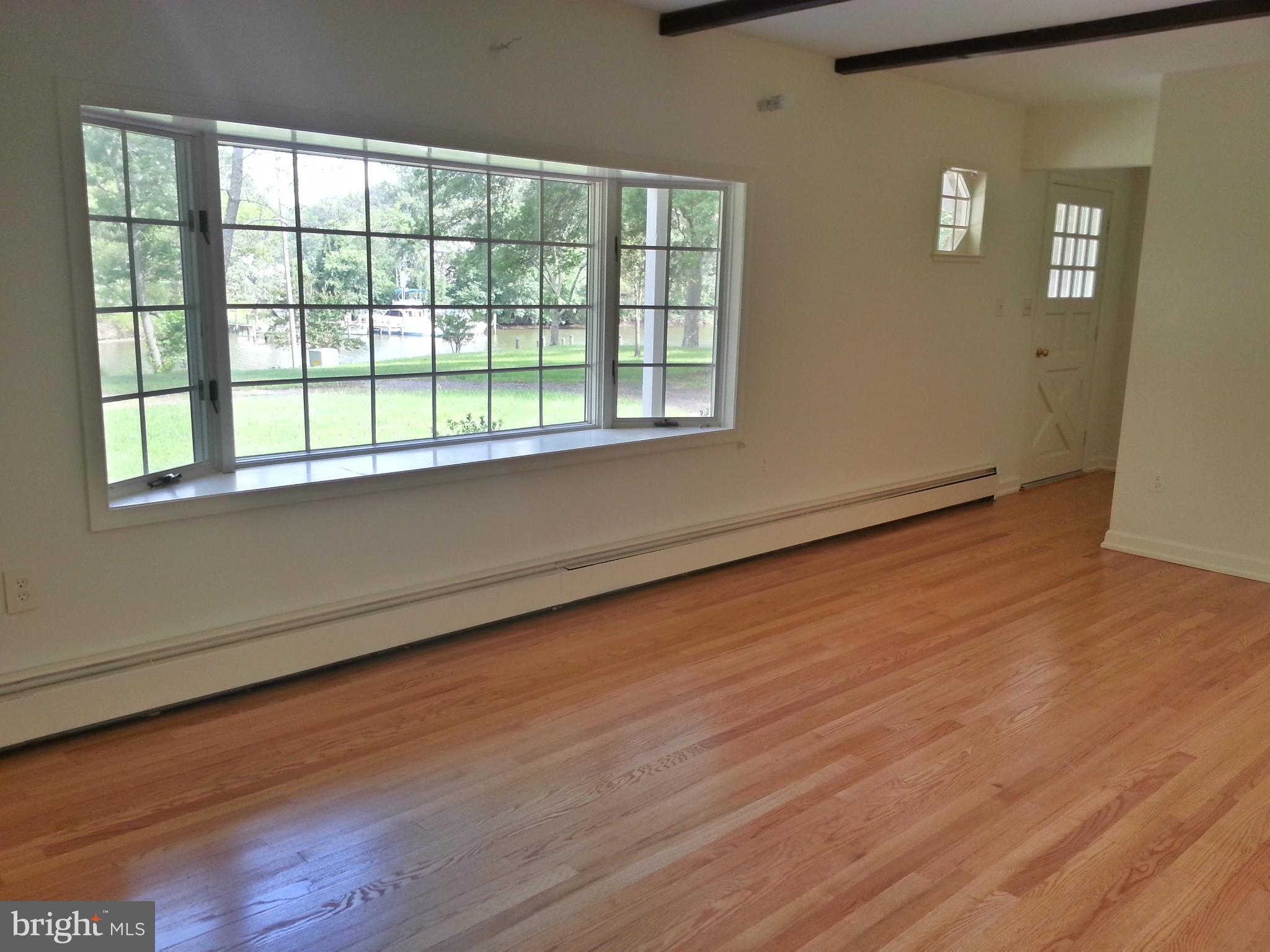 12825 Mccready Road Lusby, MD 20657 - Photo 21 of 28 Living Room to front door
