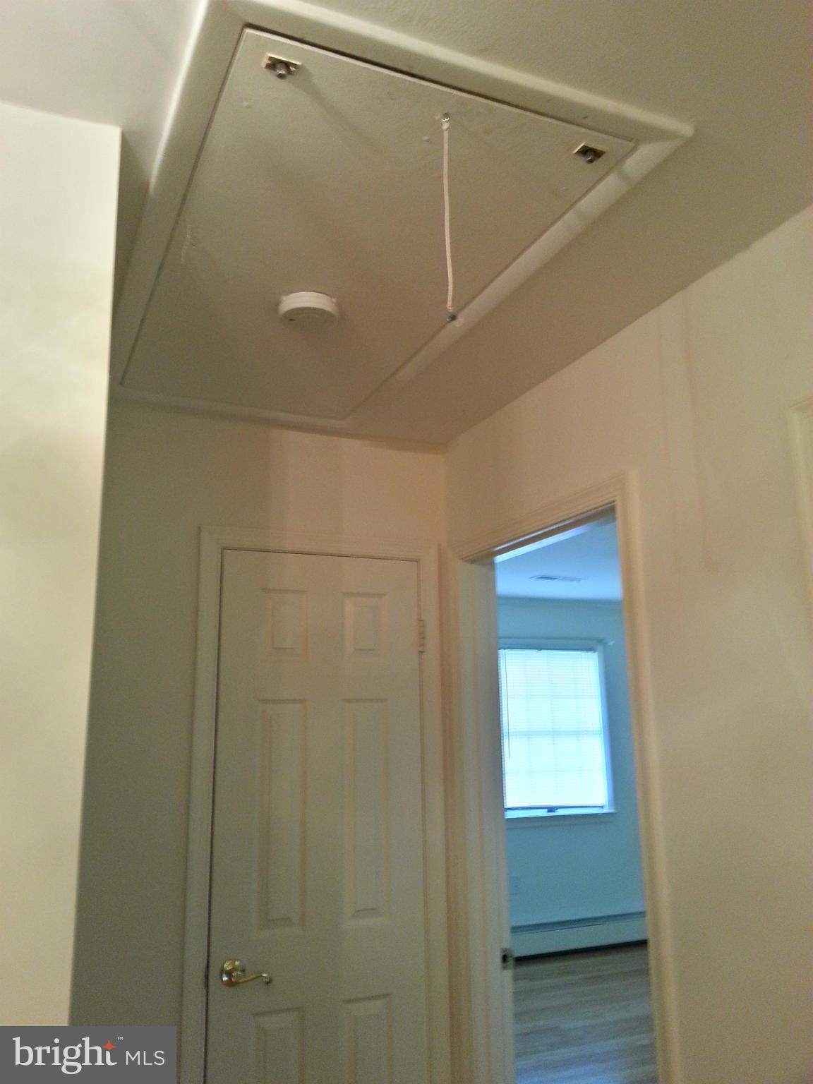12825 Mccready Road Lusby, MD 20657 - Photo 8 of 28 Attic Stairs