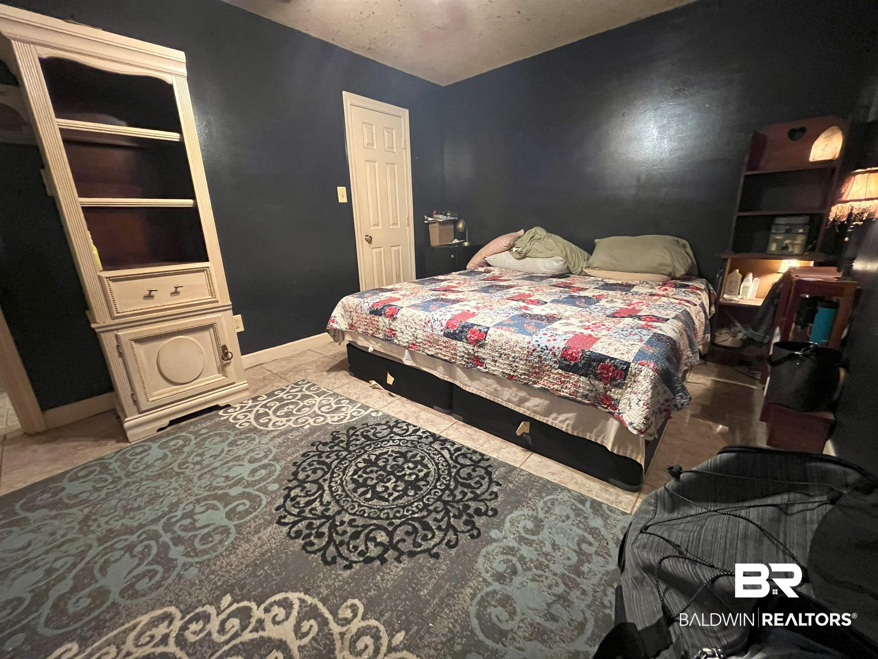 7851 Highway 98 Fairhope, AL 36532 - Photo 15 of 40 Tiled bedroom featuring baseboards