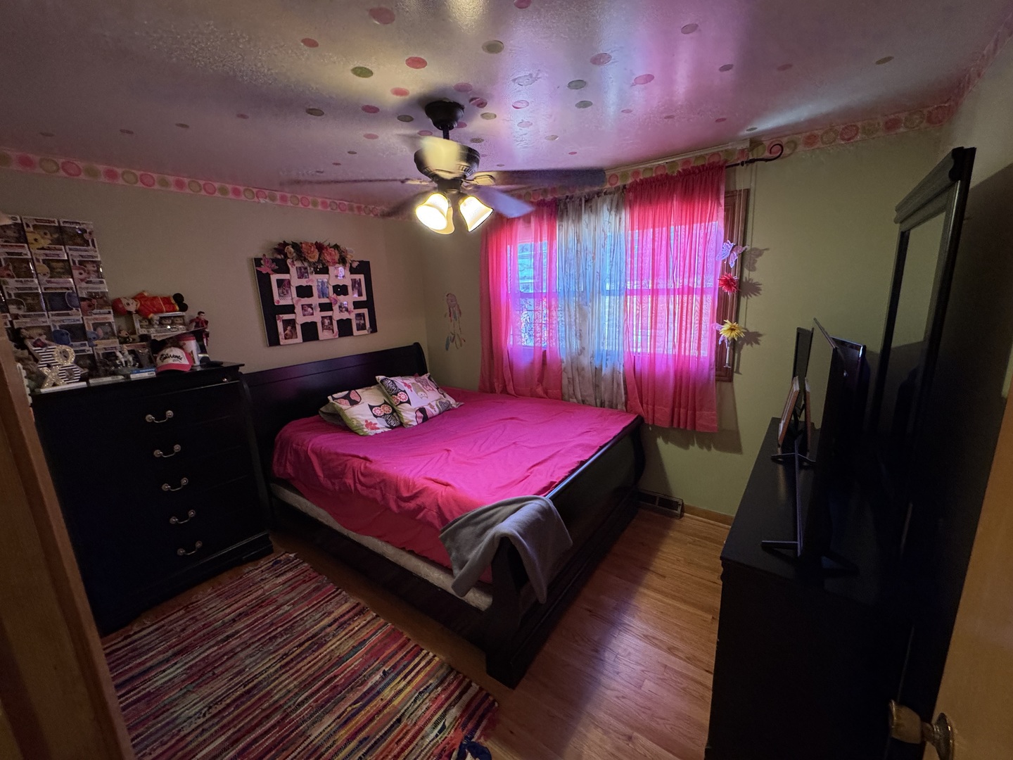 11117 South Ave L Chicago, IL 60617 - Photo 22 of 32 a bedroom with a bed and a dresser