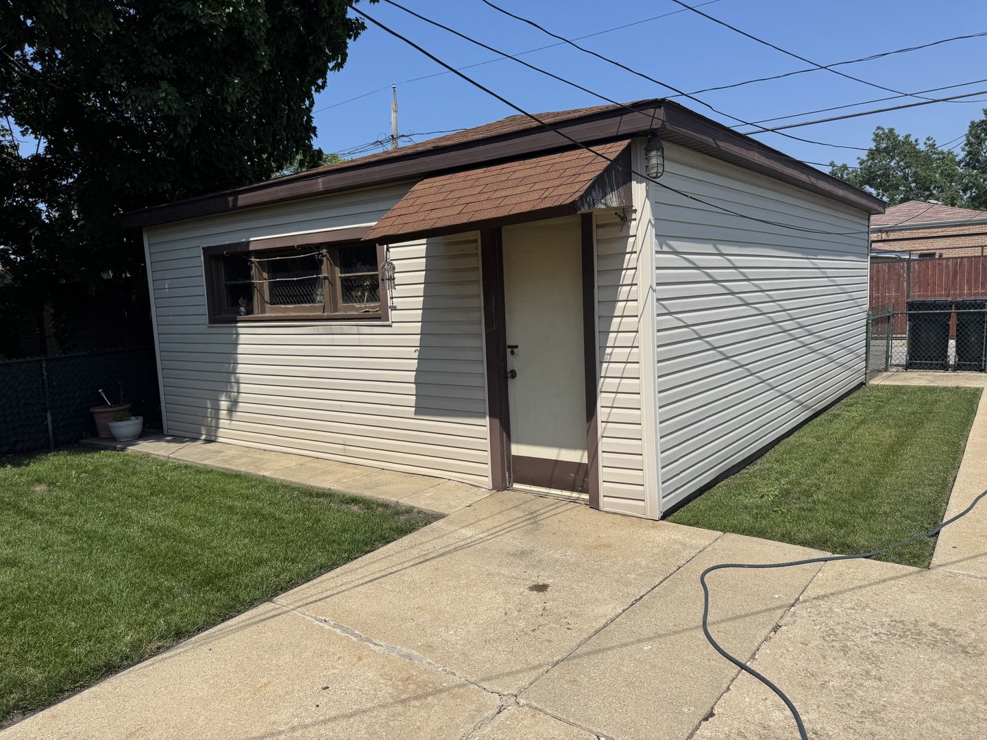 11117 South Ave L Chicago, IL 60617 - Photo 6 of 32 a view of a backyard with a garden