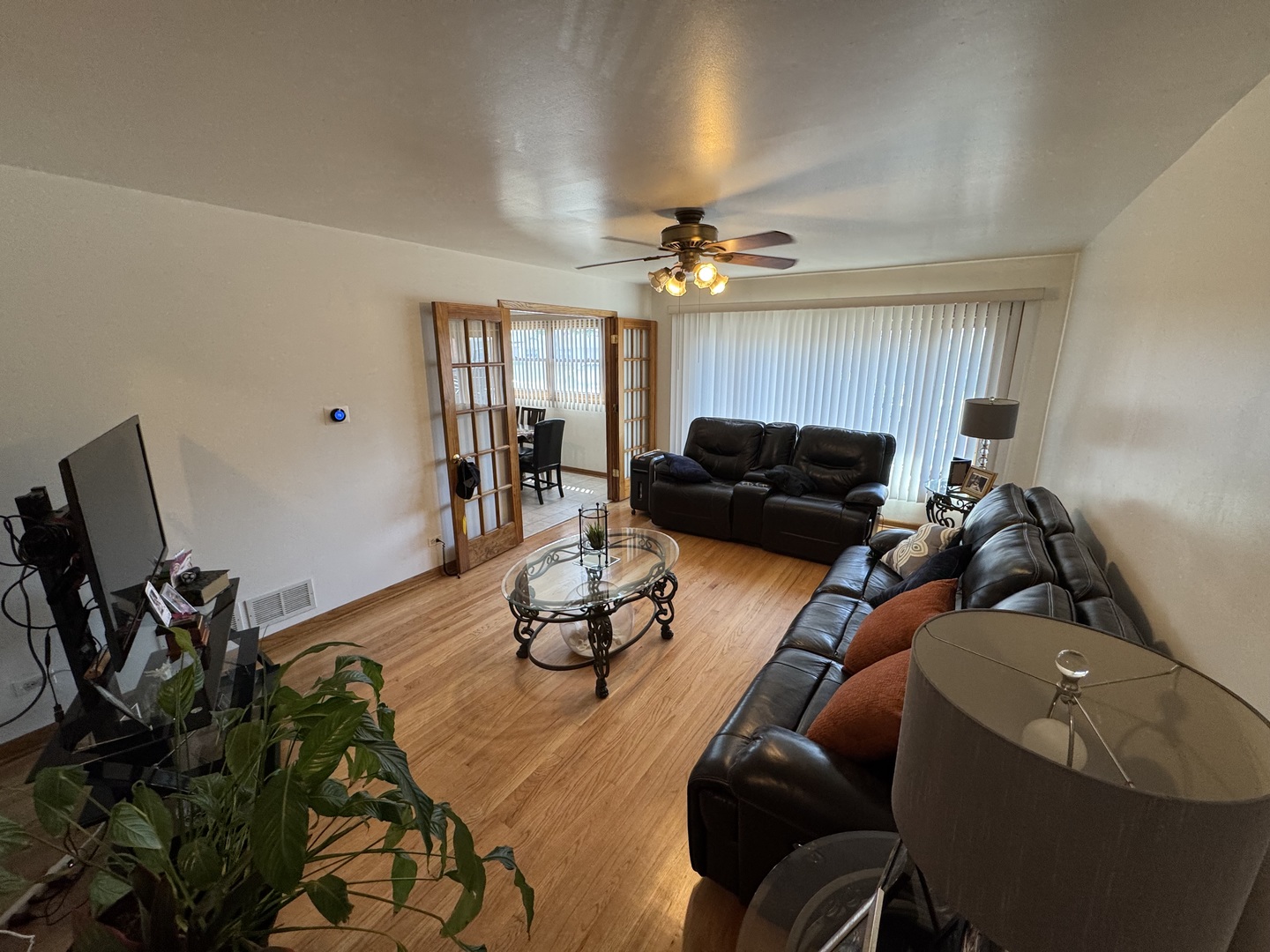 11117 South Ave L Chicago, IL 60617 - Photo 10 of 32 a living room with furniture and a flat screen tv