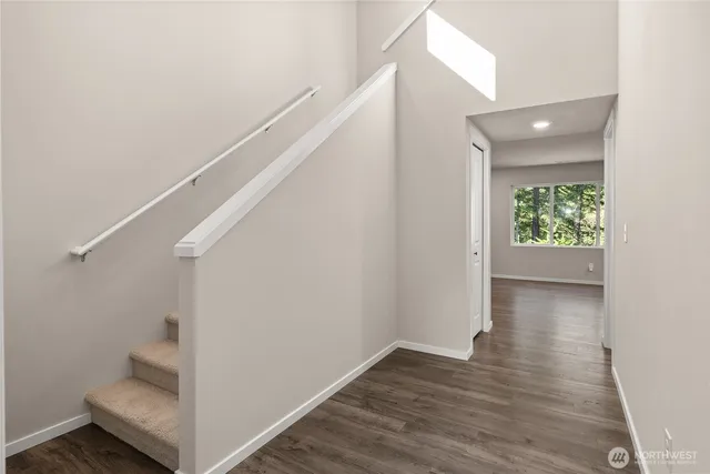 a view of an entryway with wooden floor
